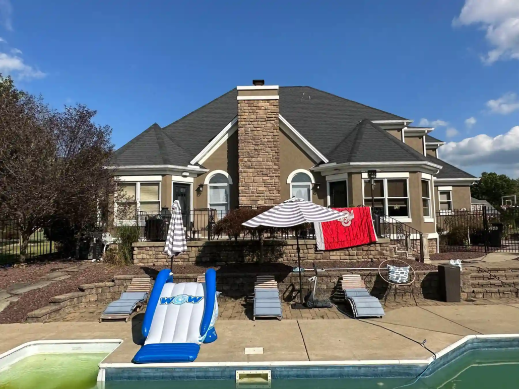 Freshly Painted House Seen from the Backyard In-Ground Pool.