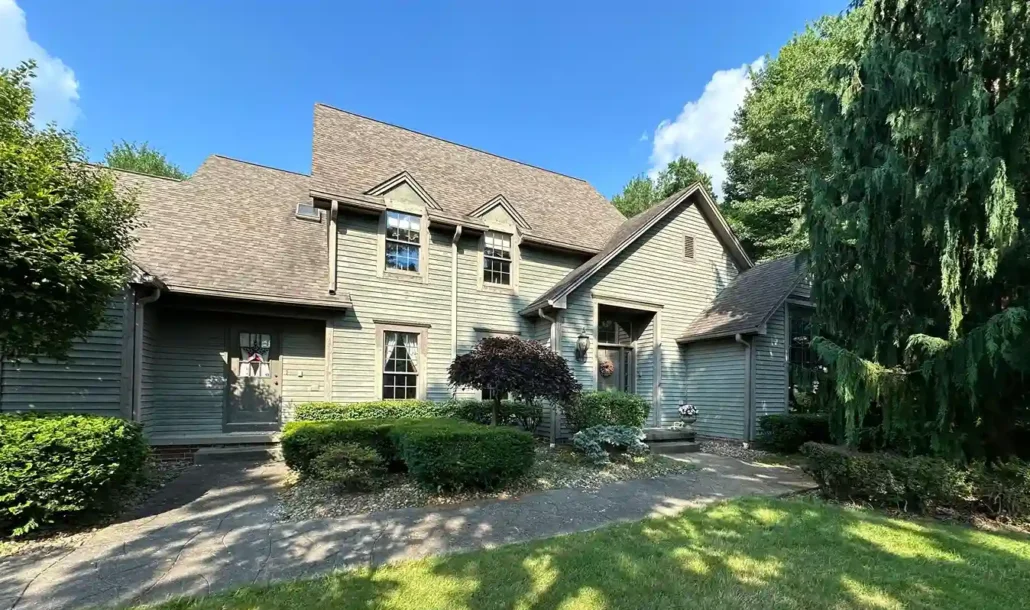 Olive Green Home in Howland Ohio Shines in the Sun After Being Painted.