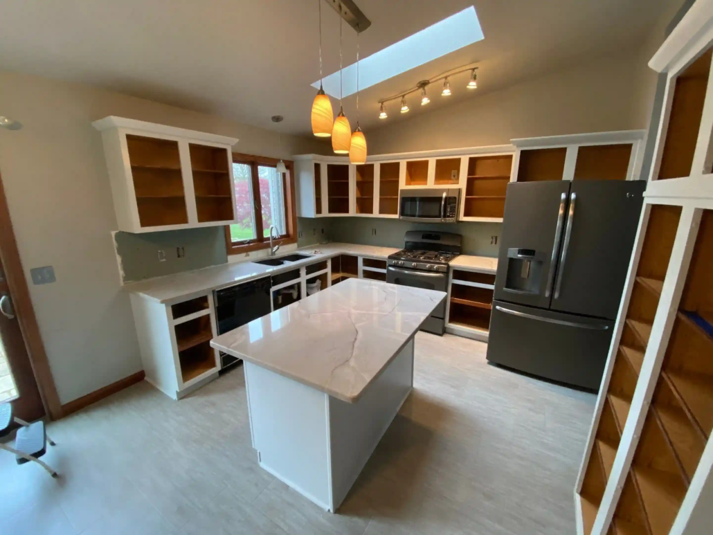 White Painted Cabinets with Their Doors Off While They Are Taken and Painted by a Northeast Ohio Cabinet Painting Company.