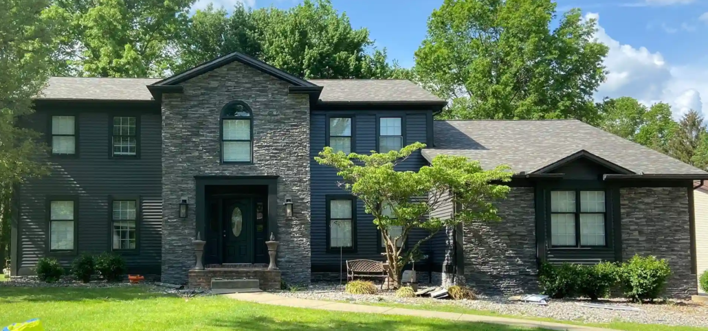 Freshly Painted Navy Blue Home in Mahoning Valley with a Stone Accent Wall.