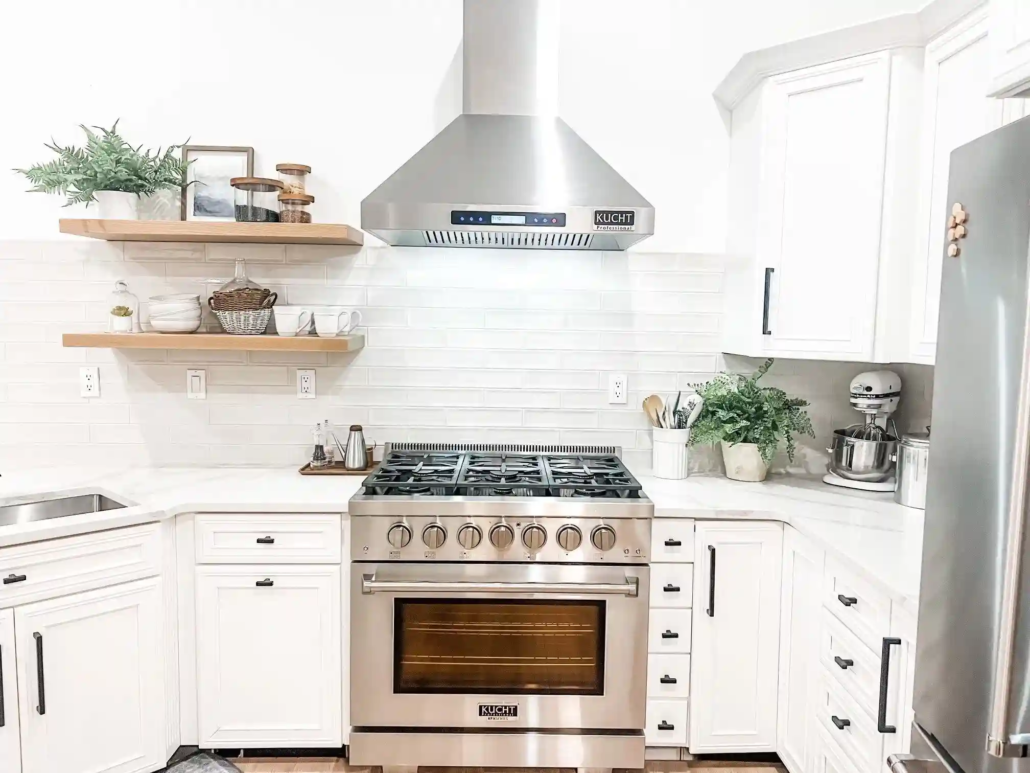White Painted Walls and White Painted Cabinets in a Kitchen with Stainless Steel Appliances.