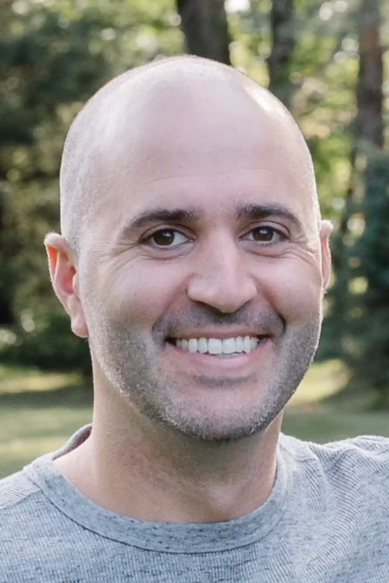 Headshot of Patsy Daltorio, Co-Owner of P & D Painting with a Green, Vibrant Background.