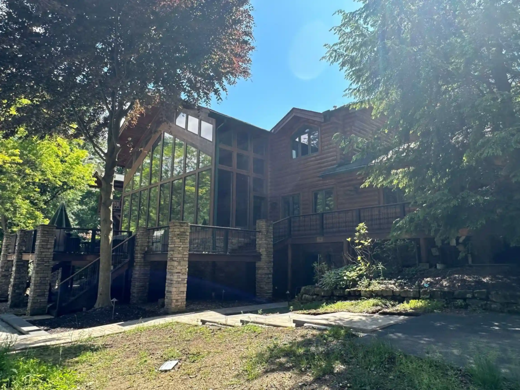 A Two-Story, Log Home Shines in the Canfield, Ohio Sun After Being Painted.