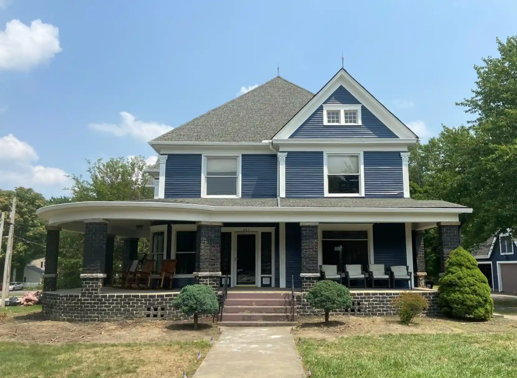 Canfield Home Shining Bright in the Sun After a Fresh Coat of Blue Paint.