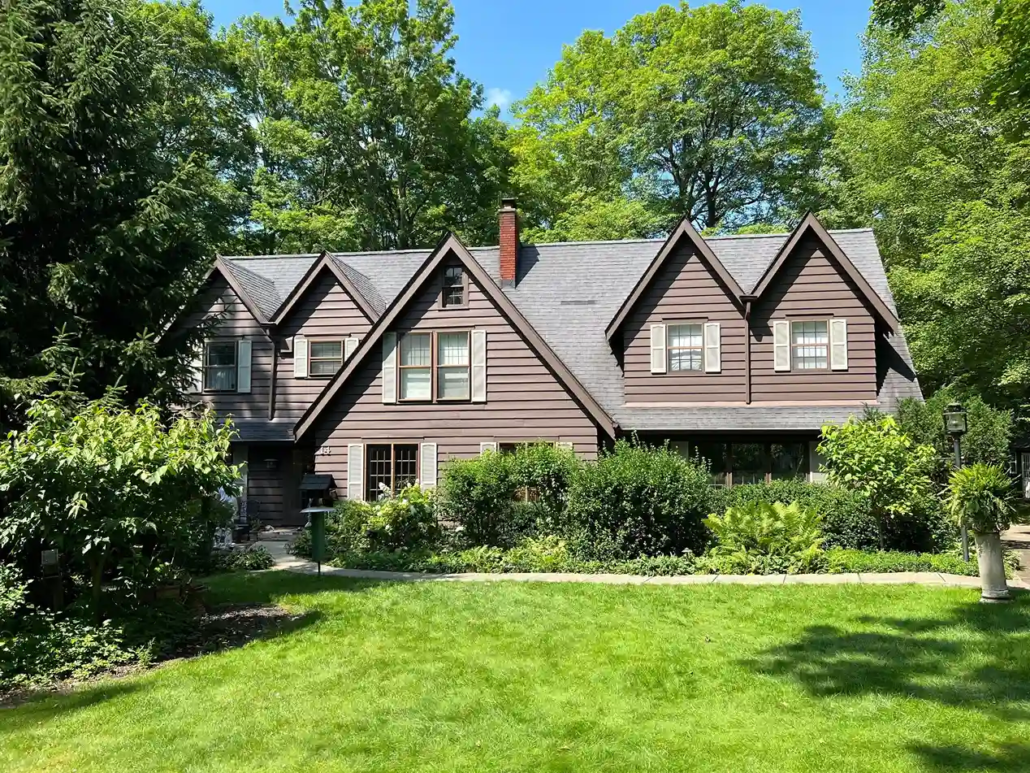 Freshly Painted Maroon Siding Glistens in the Sun in Canfield.