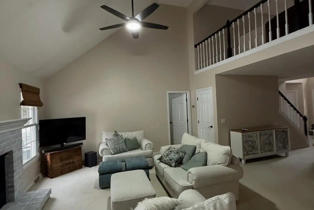 Fresh Painted Canfield Condo Walls Reflecting the Ambient Lighting From the Ceiling Fan Above.