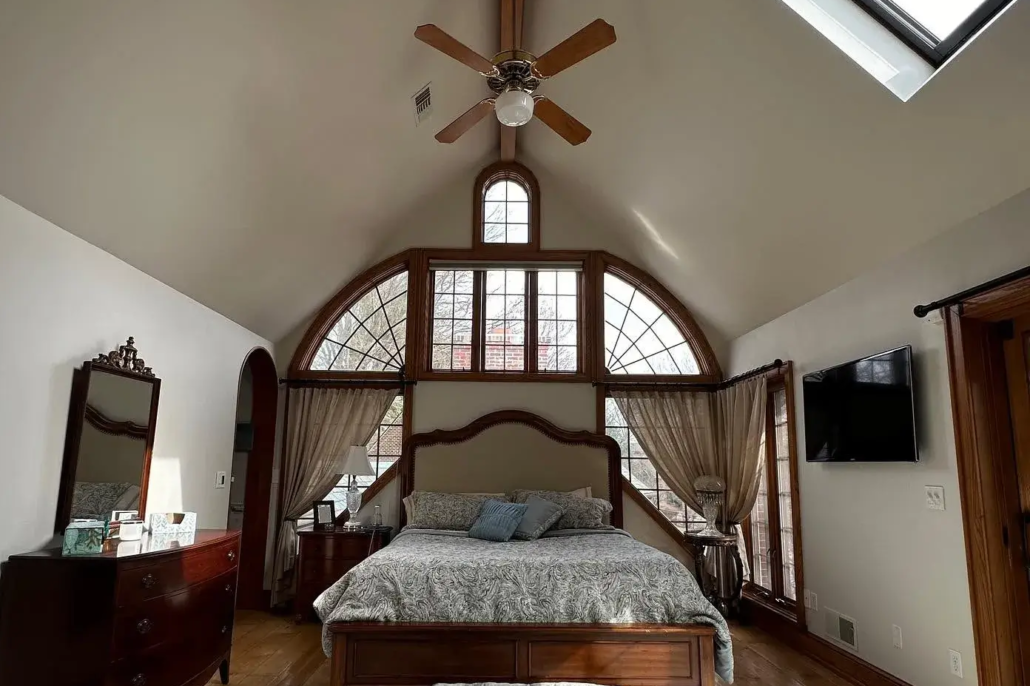 Cream White Painted Bedroom in Canfield Ohio with Beautiful, Dark Stained Wooden Accents.