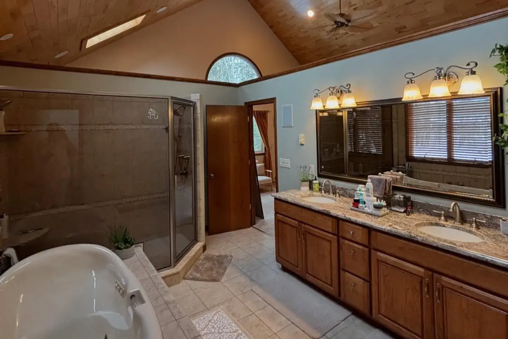 Natural Light Rushes in a Freshly Painted Bathroom with Off-White Walls and Wooden Trim.