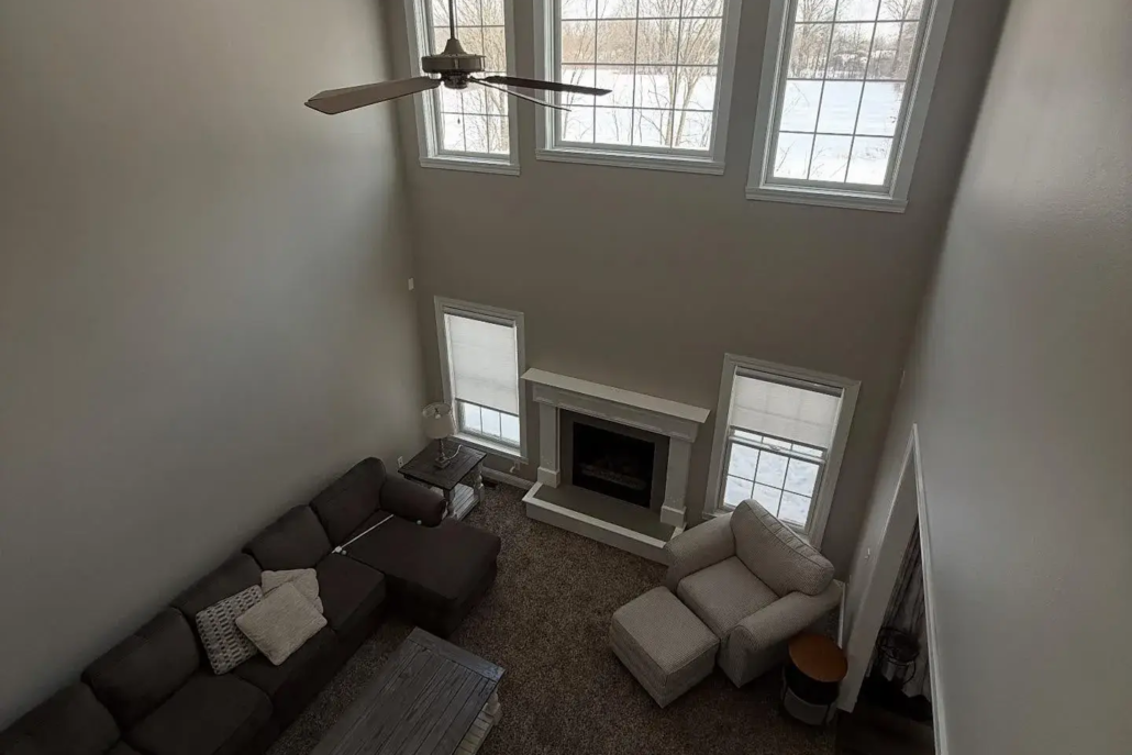Light Gray Painted Walls Reflect Natural Light from Five Windows in a Newly Painted Boardman Home.